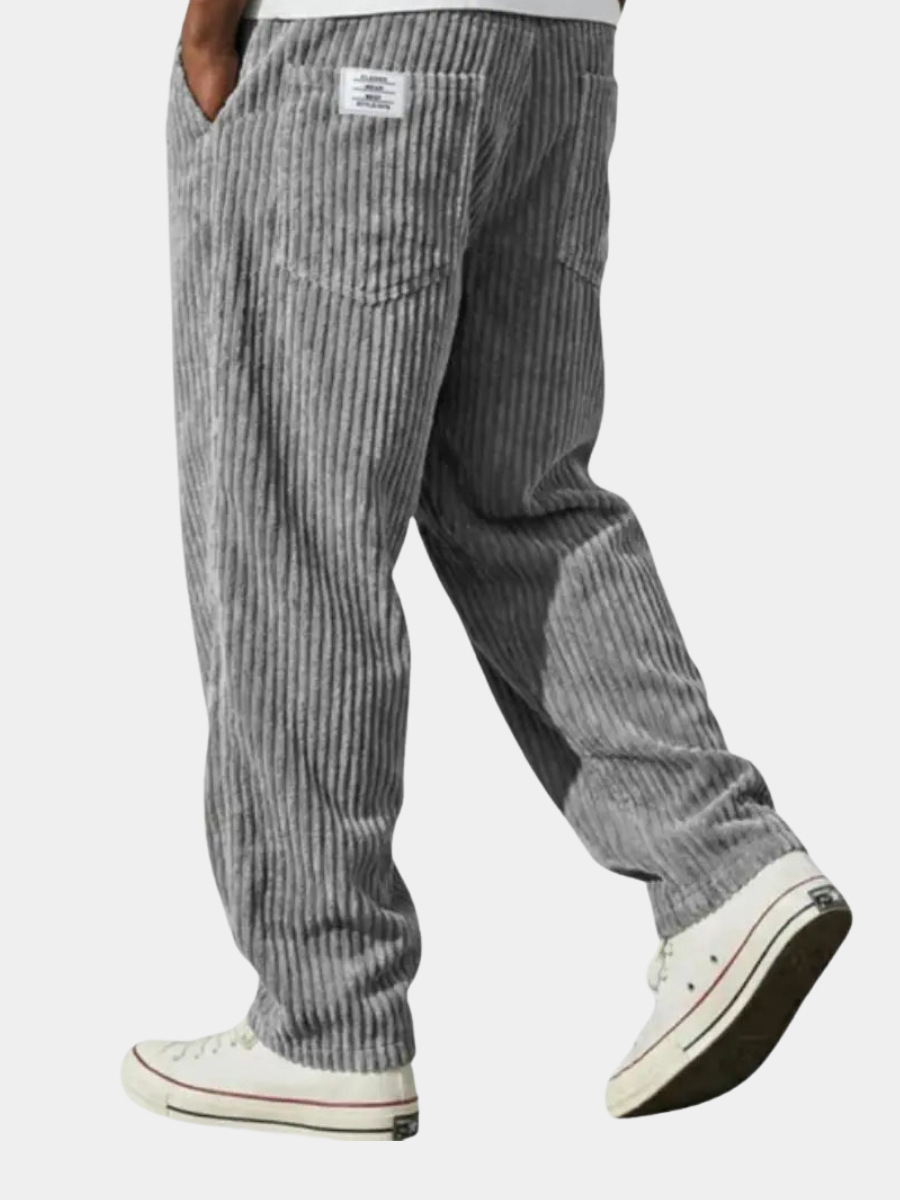 Back view of men wearing gray heritage corduroy pants with white sneakers