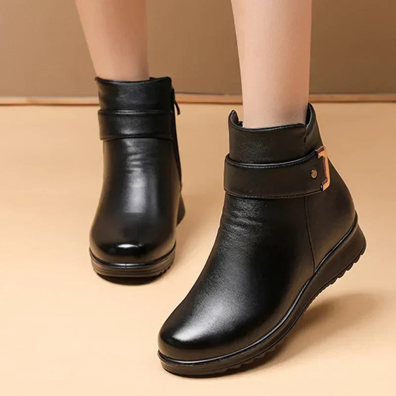 Front angle view of women's black winter boots showcasing the sleek design