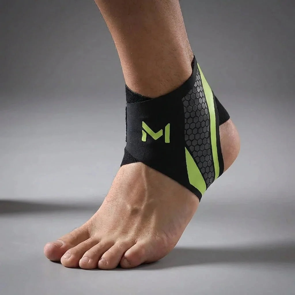 Close-up of an athlete wearing a Black Green adjustable ankle support sleeve on the left foot.