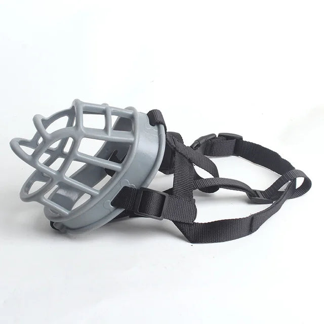 Gray flexible silicone dog muzzle viewed from the side on a white background