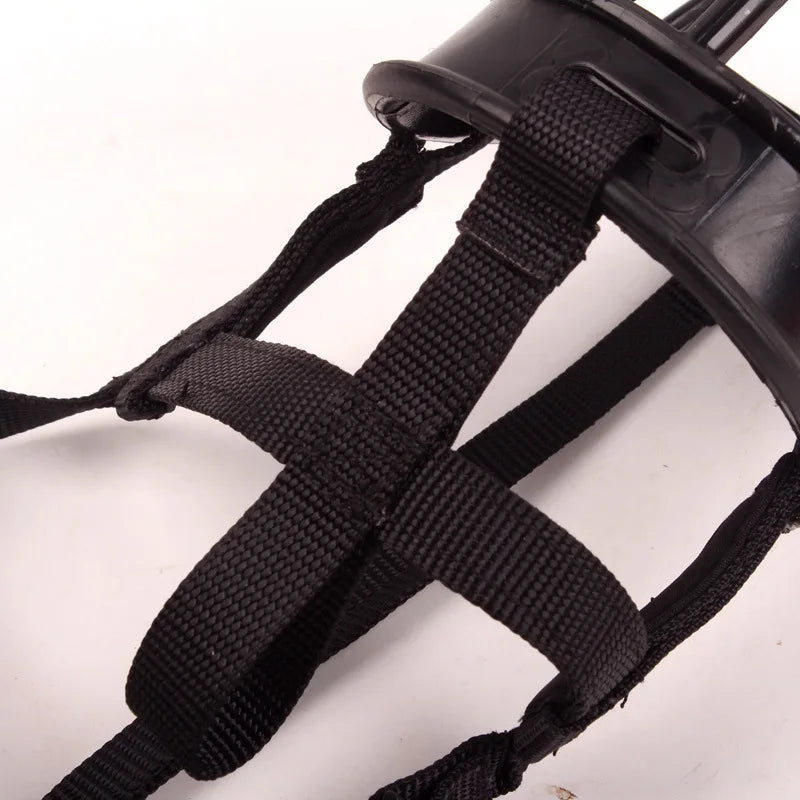 Pet safety dog bite prevention muzzle laid flat showing durable and flexible straps