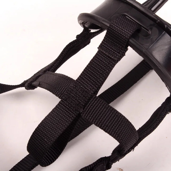 Pet safety dog bite prevention muzzle laid flat showing durable and flexible straps