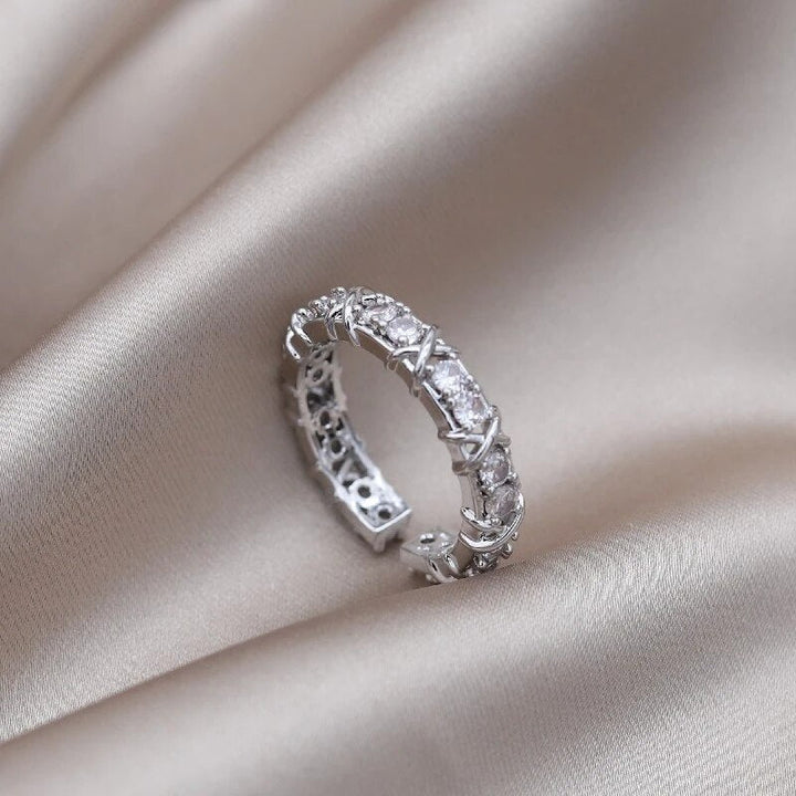 Close-up of the silver adjustable magnetic wellness ring with crystal stones