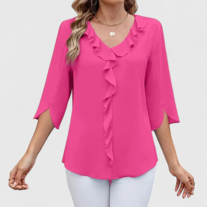 Trendy V-neck blouse for women featuring soft 3/4 sleeves and feminine ruffle details.