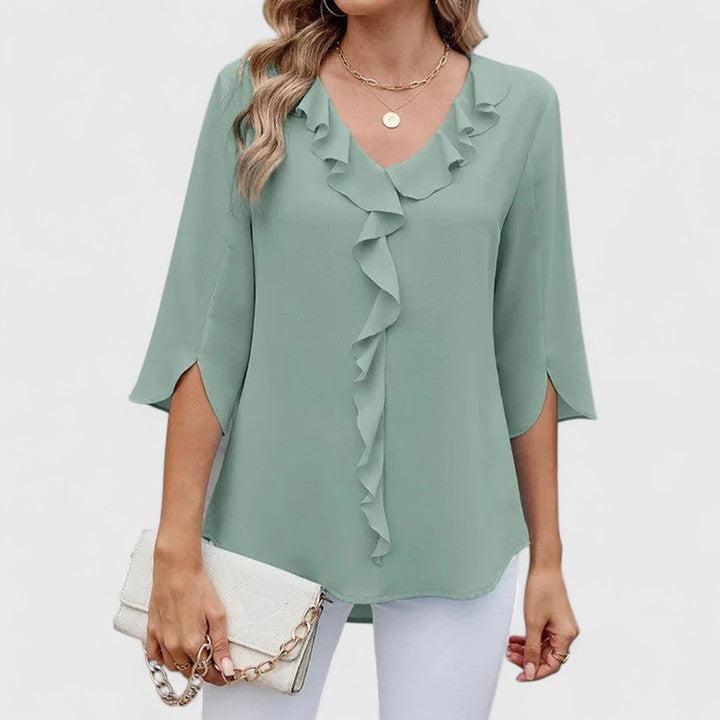Stylish women's top with V-neck, 3/4 sleeves, and chic ruffle front design.