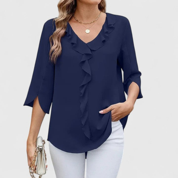 Elegant women's blouse styled with a delicate ruffle front and versatile 3/4 sleeves.