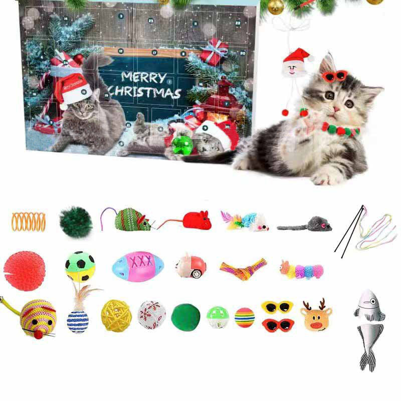 Cat advent calendar box displayed next to various holiday cat toys and a kitten wearing a festive collar