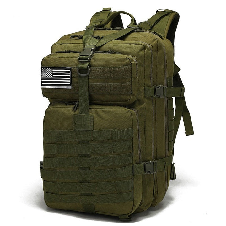 Green tactical backpack standing upright displaying front pouch and straps