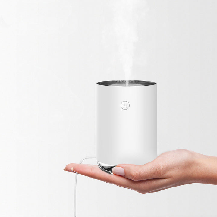 Ultrasonic diffuser and air humidifier releasing a fine hydrating mist for home wellness.