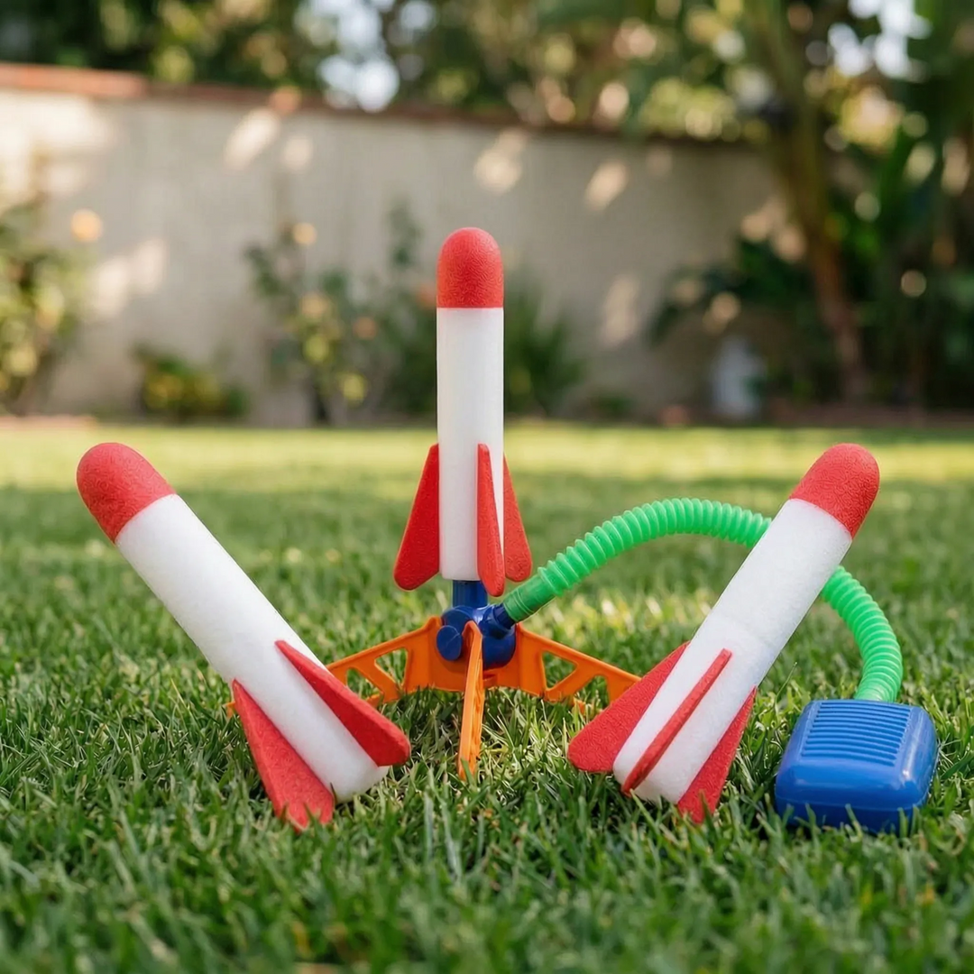 Child stomping on foot pump to launch air powered rocket toy outdoors