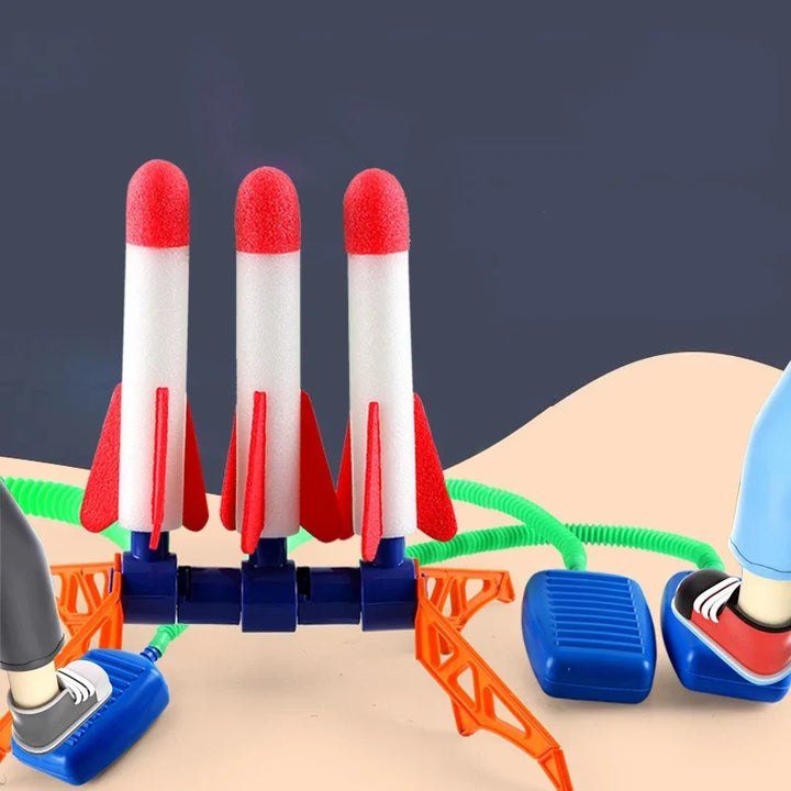 Outdoor toy foot pump connected to launch pad for active play