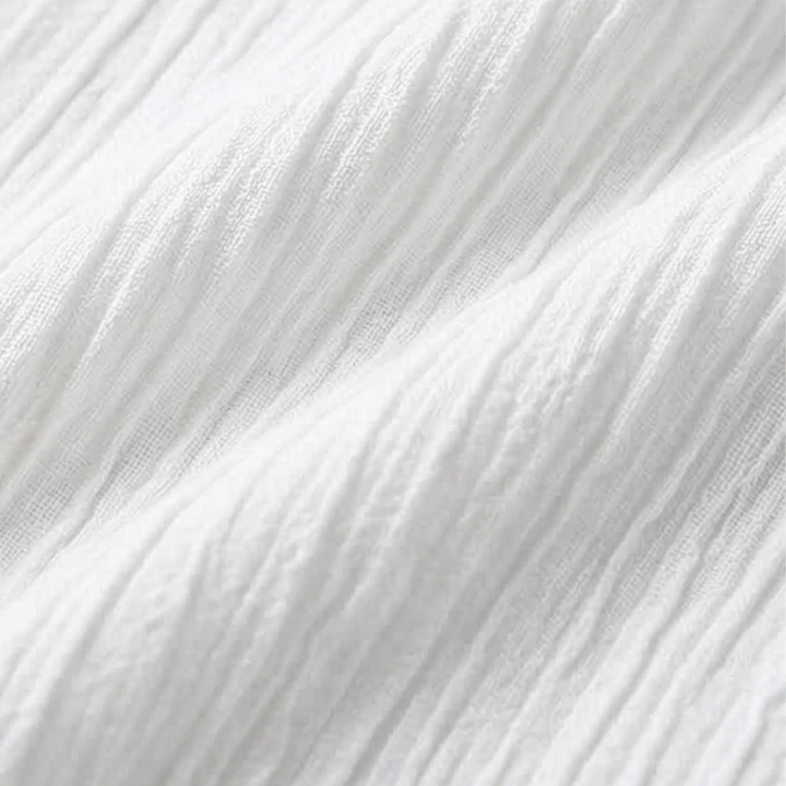 Close-up view of crinkle fabric texture on women's short sleeve blouse