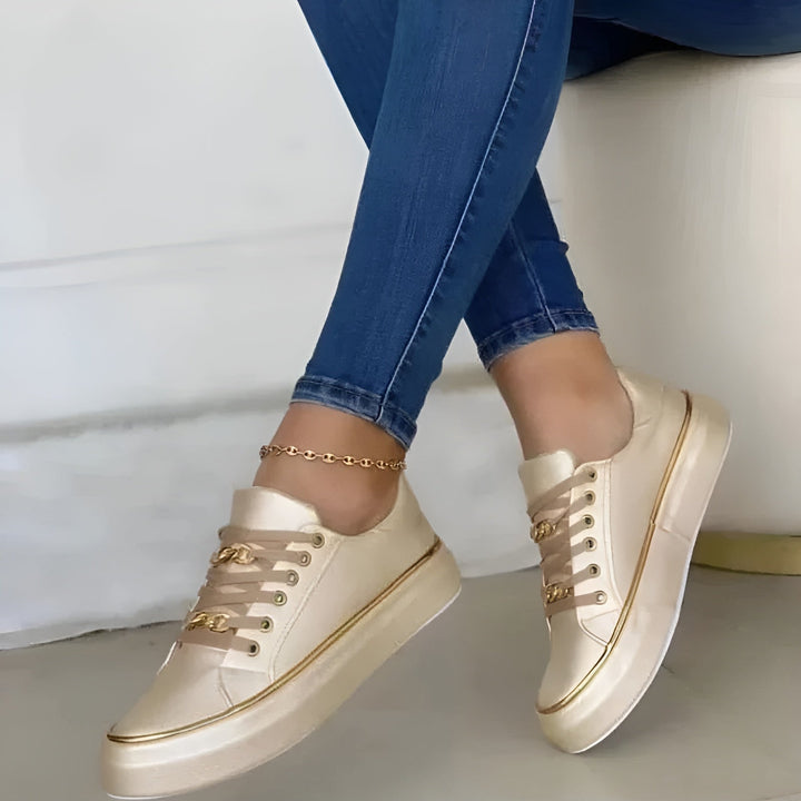 Side angle of women's chic comfort sneakers showcasing casual footwear design