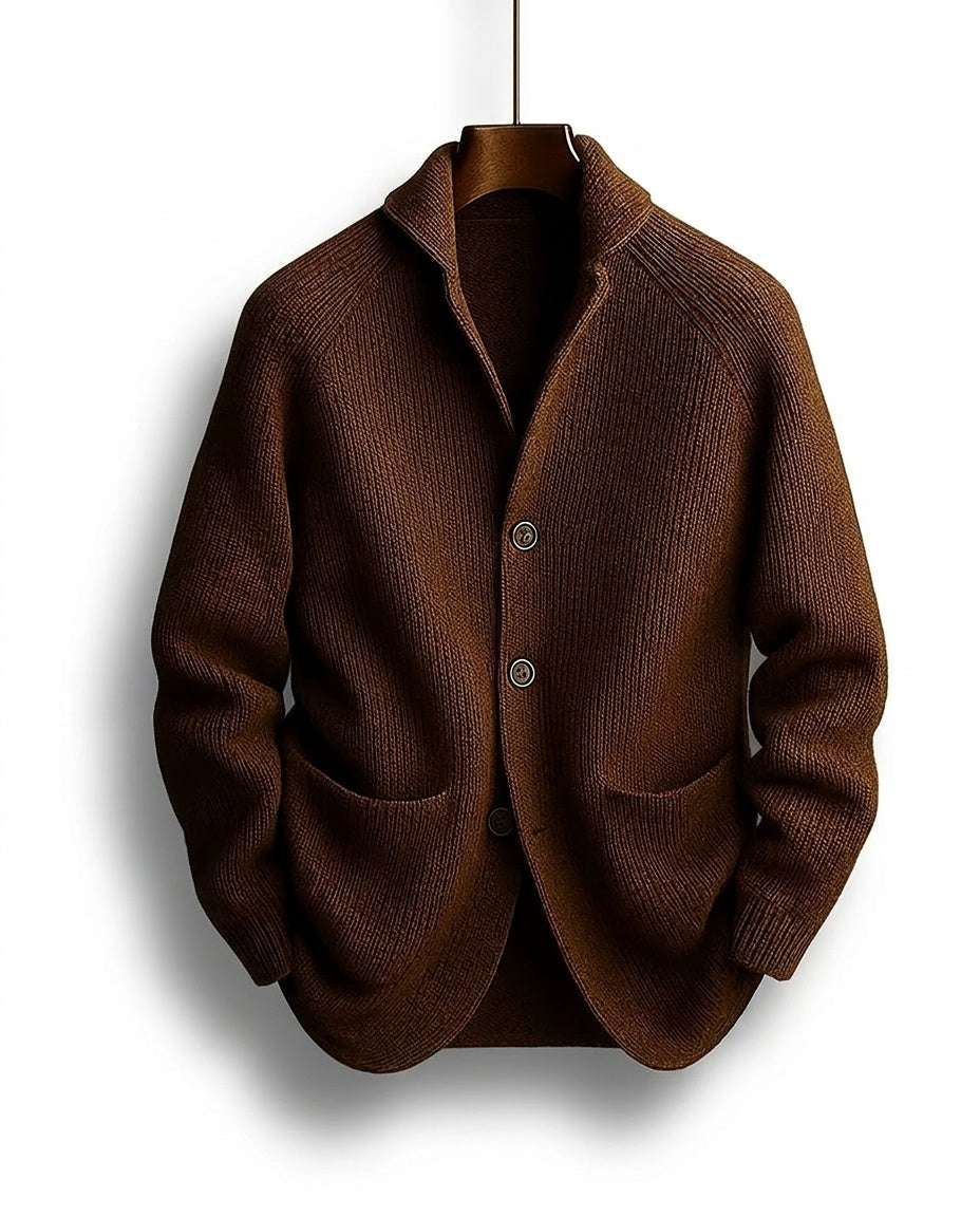 Brown knit cardigan with shawl collar and buttons hanging on a hanger