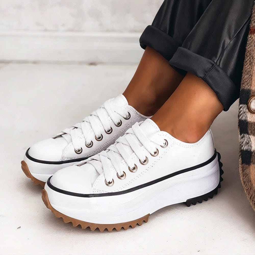 Side angle view of women's lightweight breathable platform sneakers showing sole