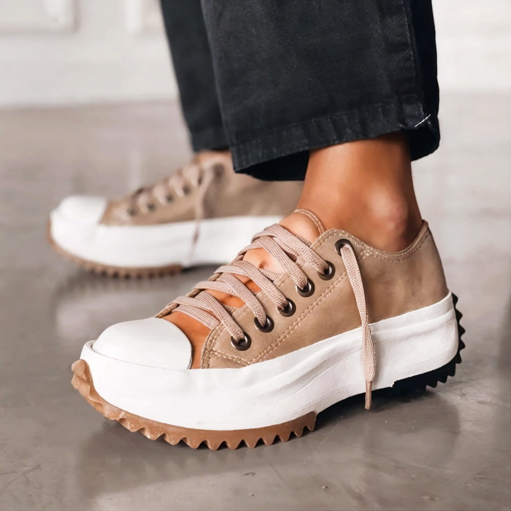 Brown athletic platform sneakers showcasing detailed lacing and side profile