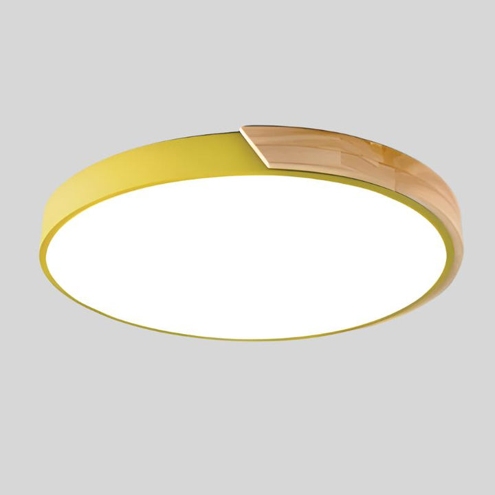 Pastel colored wooden ceiling lamp adding warmth to scandinavian decor