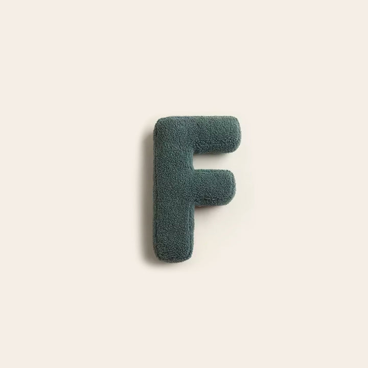 Decorative alphabet cushion shaped like a letter for bed
