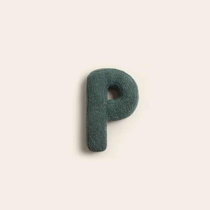 Alphabet pillow decorative cushion styled on wooden chair