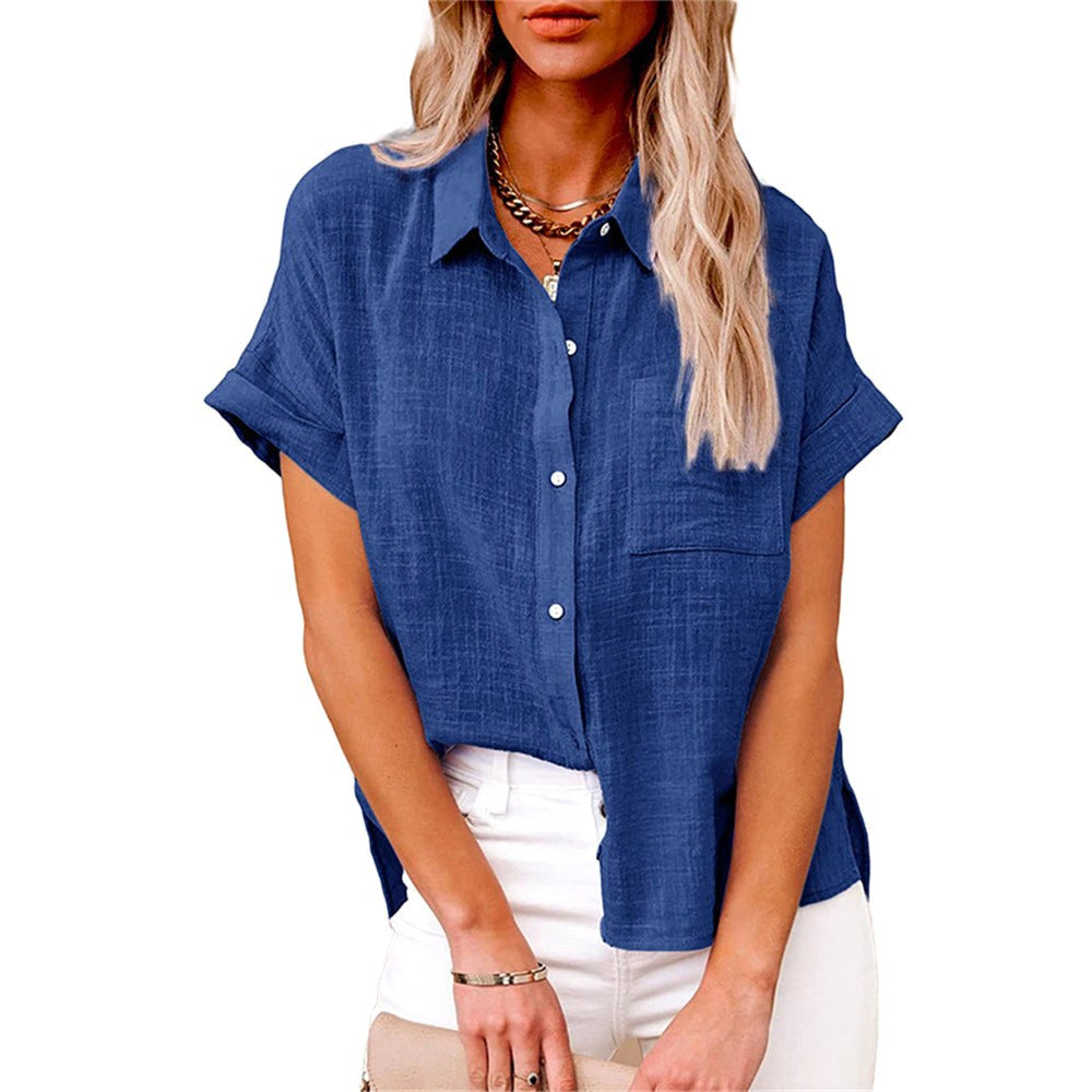 Woman wearing a royal blue button-front short sleeve blouse