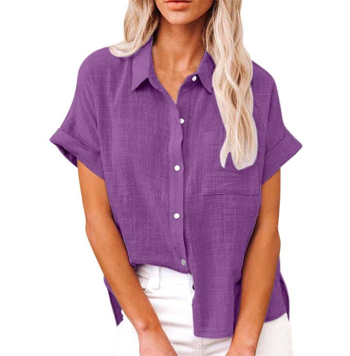 Close-up of lightweight button-front short sleeve blouse fabric and buttons