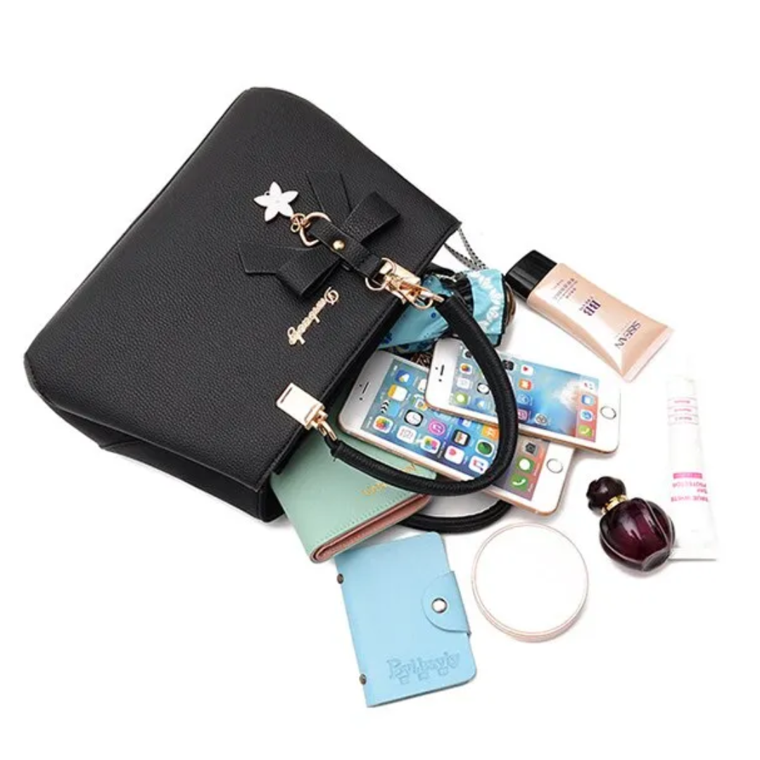 Model wearing women's Anna crossbody bag with bow charm in daily outfit