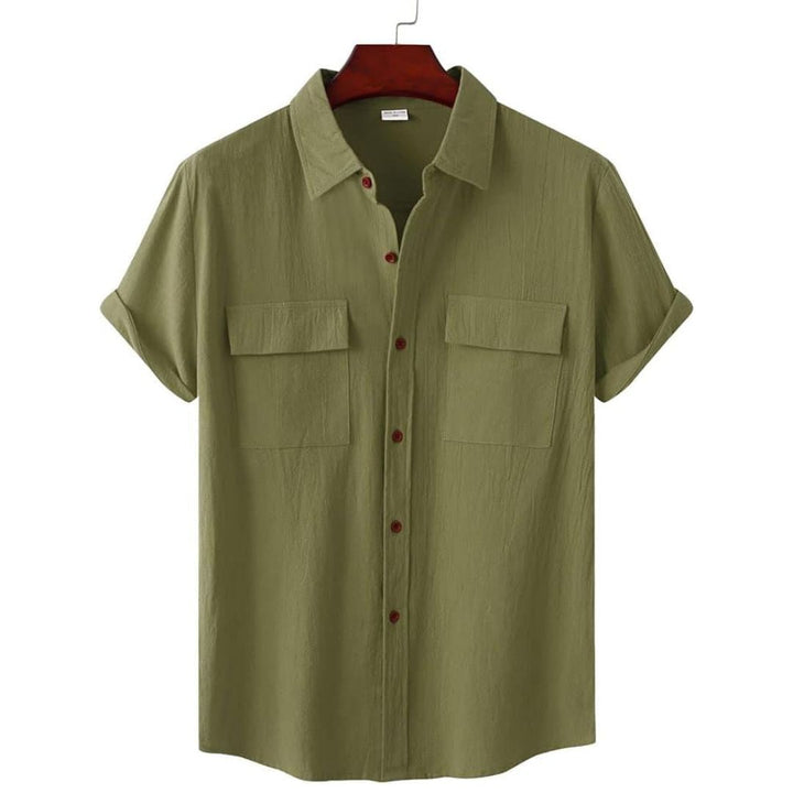 Close up of the fabric and button details on a womens casual short sleeve blouse.