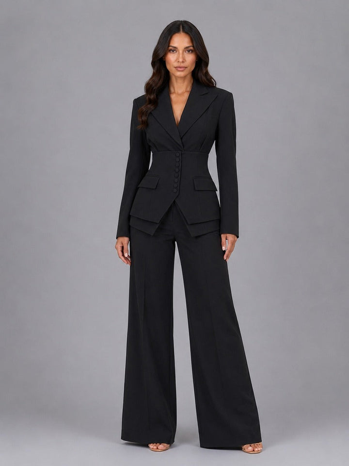 Model wearing Black two-piece suit featuring structured blazer and wide leg pants