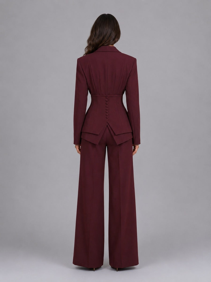 Back view of elegant two-piece women's suit featuring wide-leg palazzo pants