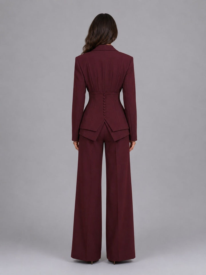 Back view of elegant two-piece women's suit featuring wide-leg palazzo pants