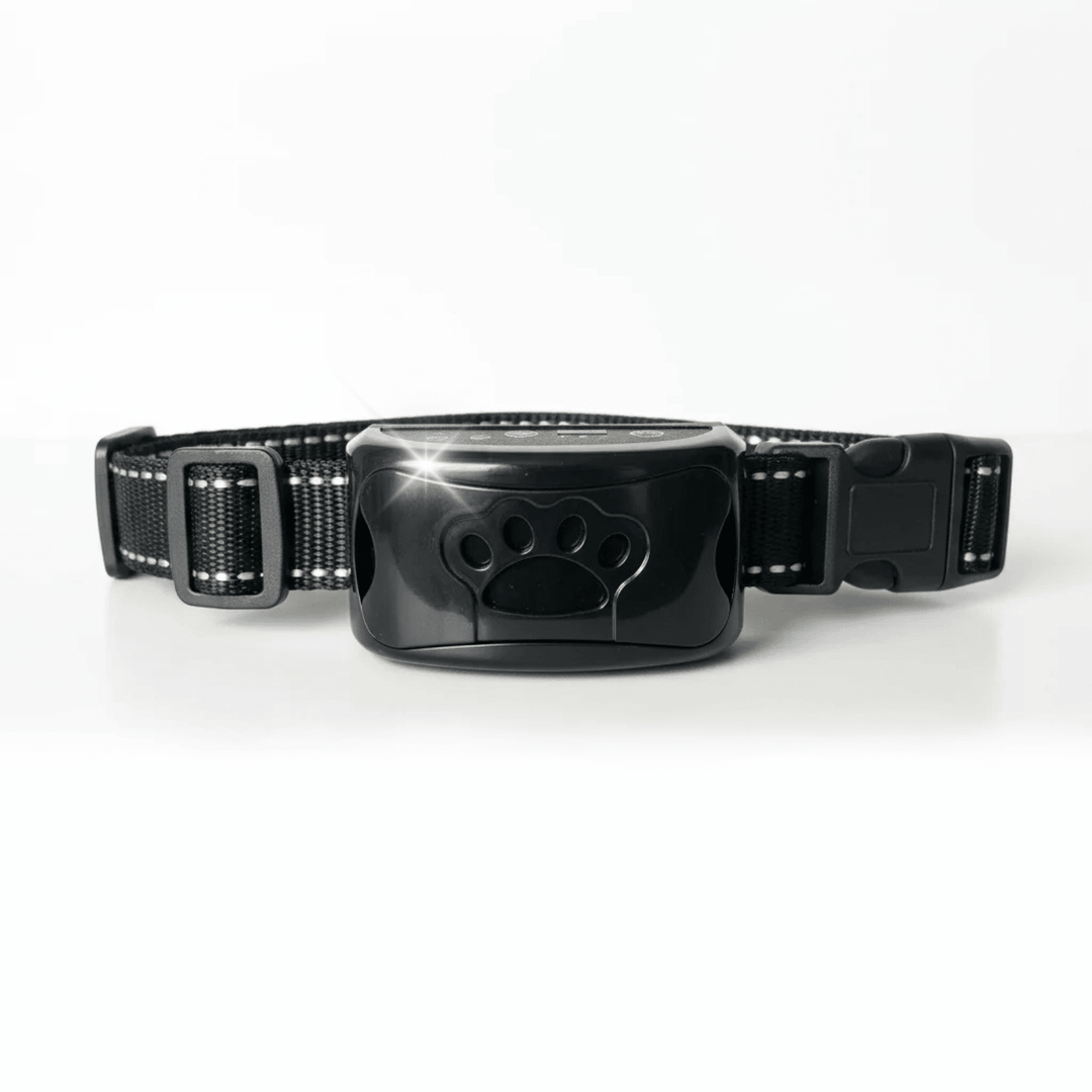 Black anti-bark dog collar with paw print receiver on a clean white background