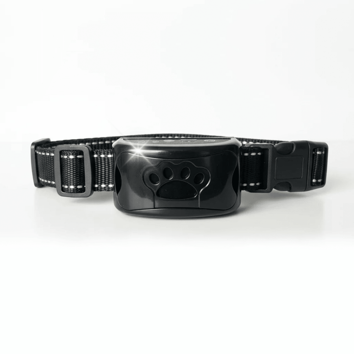 Black anti-bark dog collar with paw print receiver on a clean white background