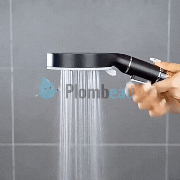Handheld shower head in action with active water spray stream