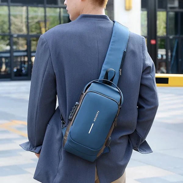 Person wearing the blue anti-theft chest bag over the shoulder in an urban setting