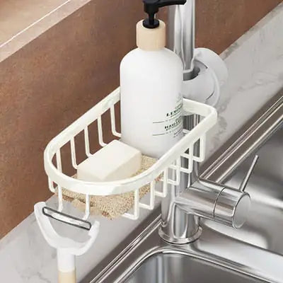 Silver stainless steel shower shelf mounted on a pipe holding a bottle and soap