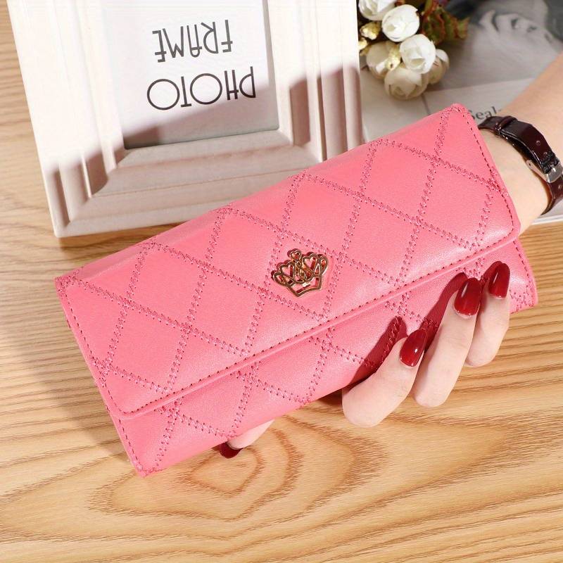 Side profile of the women's argyle wallet showcasing its slim trifold construction.