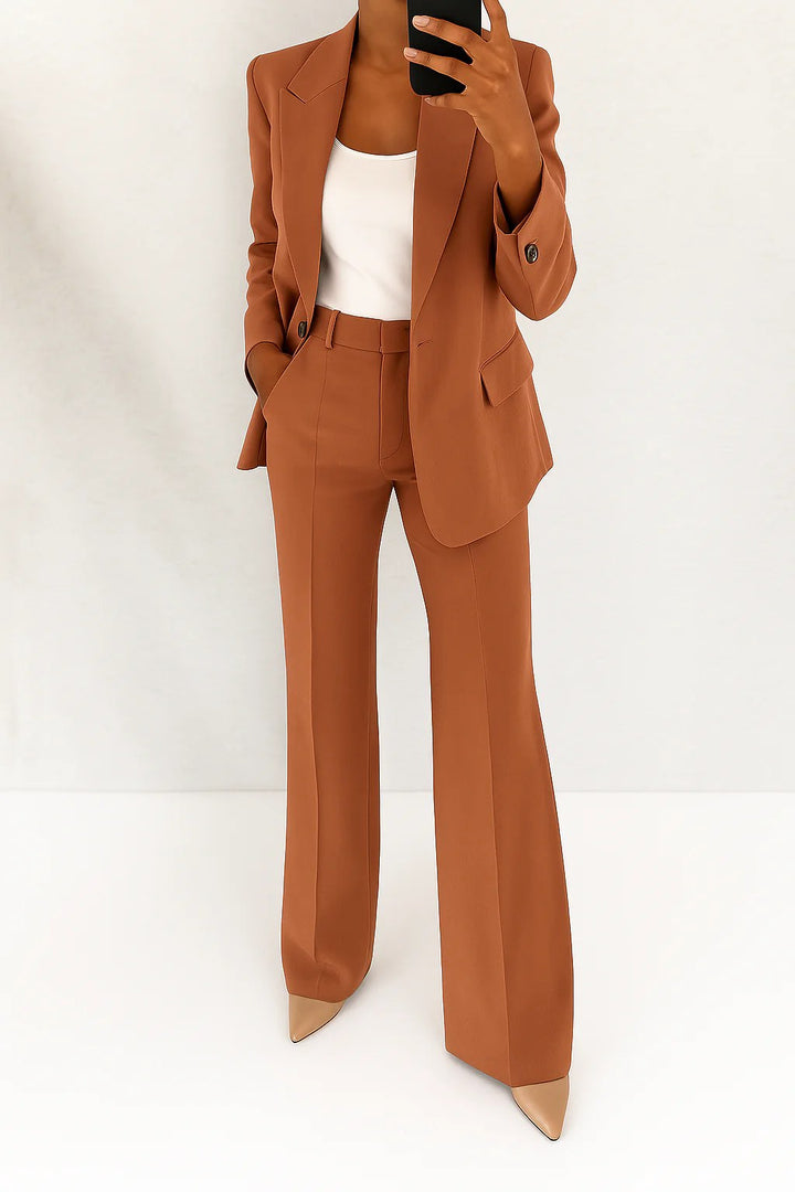 Full view of women's two-piece structured blazer and wide leg trousers suit