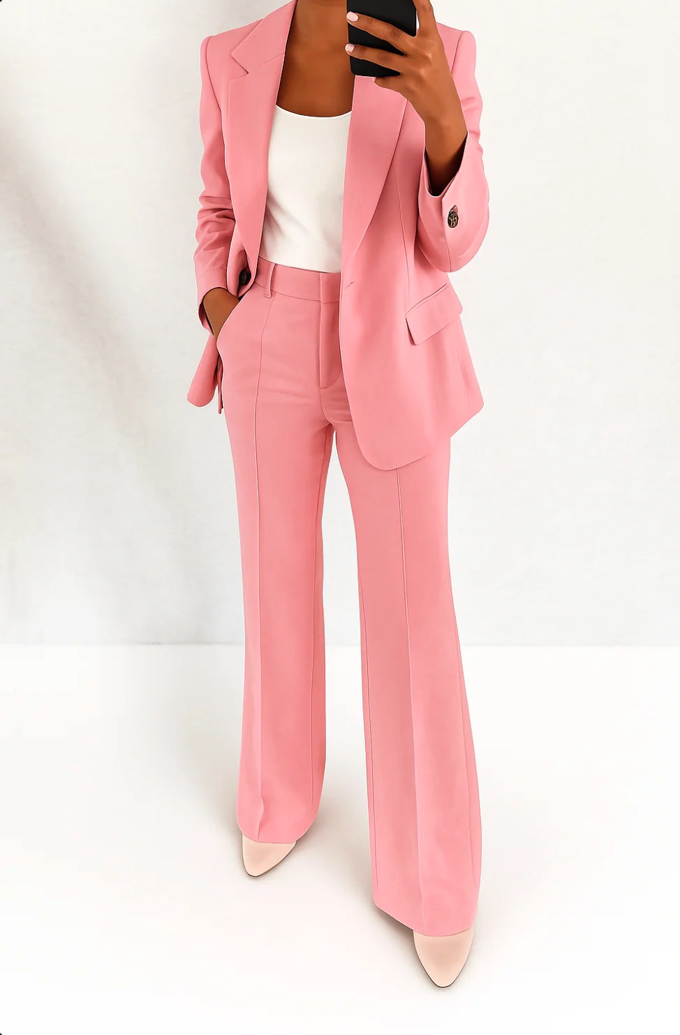 Close-up of tailored blazer lapel and button detail on business casual suit