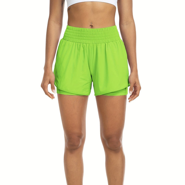Detailed shot of waistband on women's high-waisted double-layer workout shorts