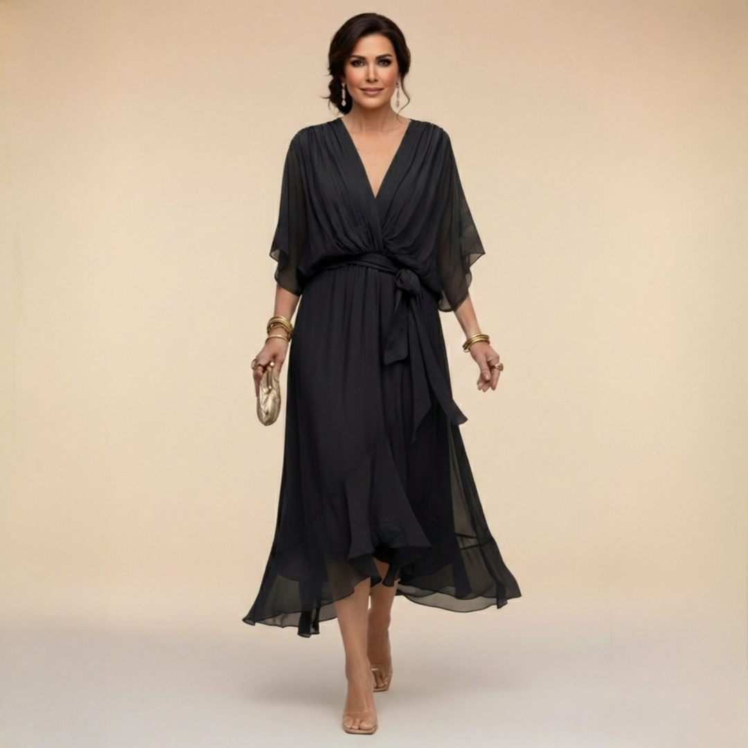 Model wearing the black belted v-neck midi cocktail dress