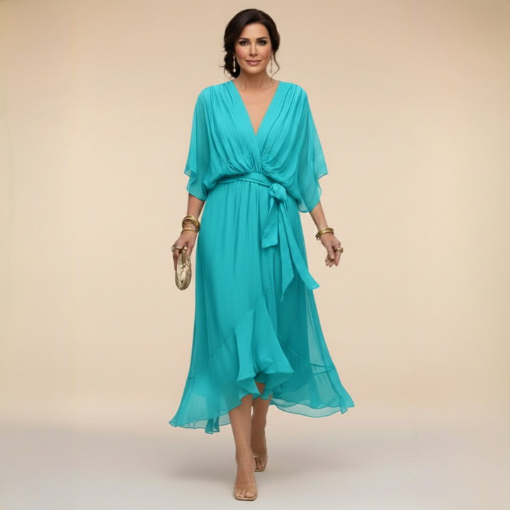 Close-up of elegant V-neckline and fabric on women's belted midi party dress