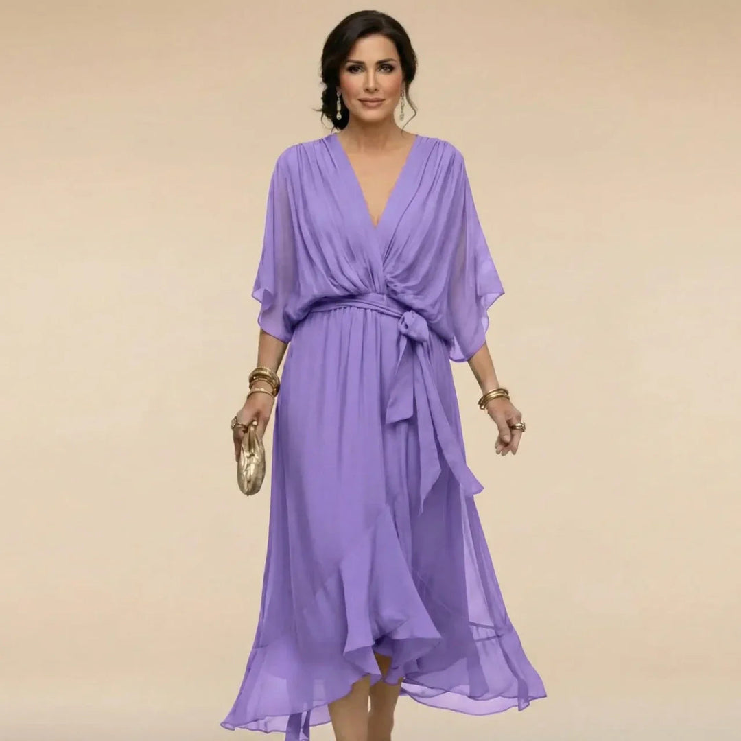 Detail of waist belt and pleated design on women's elegant cocktail party dress