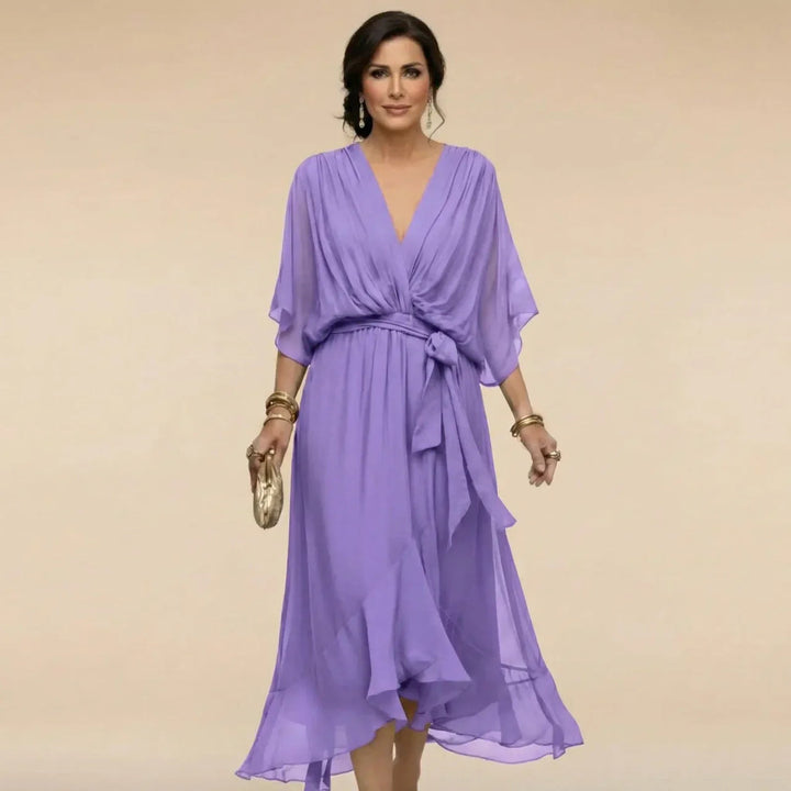 Detail of waist belt and pleated design on women's elegant cocktail party dress