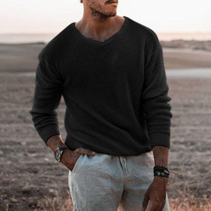 Men's casual black soft knit sweater outdoors