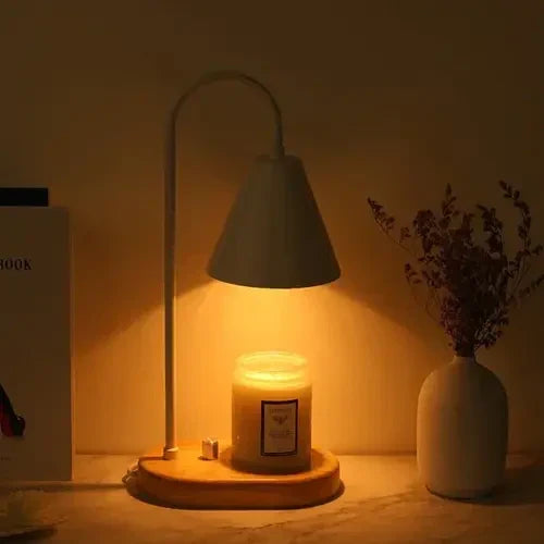 Warm ambient glow emitted by the white candle warmer illuminating a jar candle at night