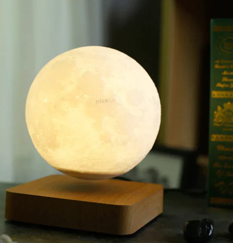 Close-up view of the levitating moon sphere and base