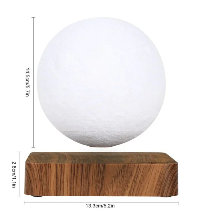 Close-up of the textured floating moon lamp glowing softly as night light