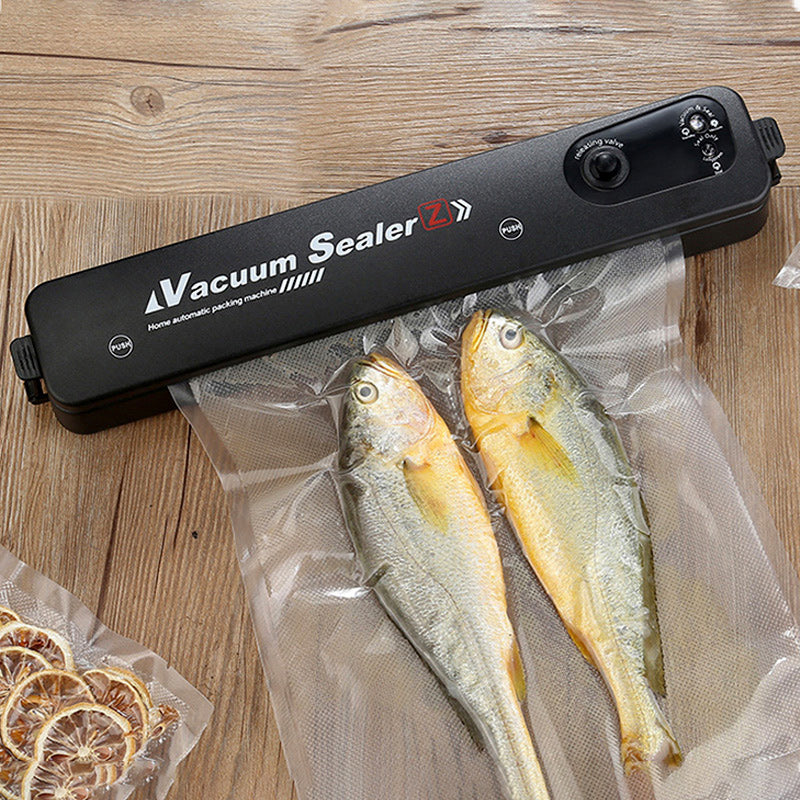 Kitchen vacuum sealer sealing dry food storage bags efficiently