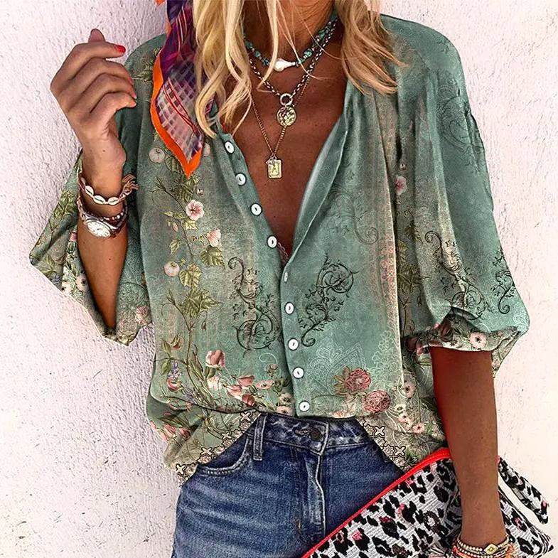 Woman wearing green boho floral blouse with button-front design and botanical print