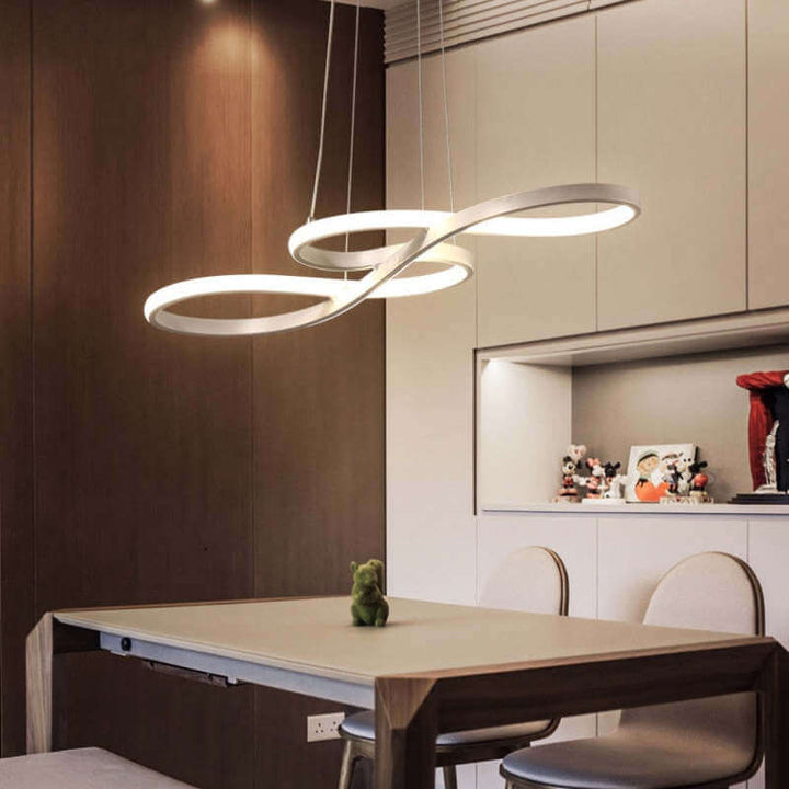 White musical note LED pendant lamp installed above a modern dining area